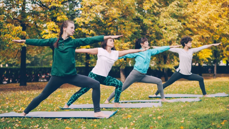 Beginners practicing yoga in a peaceful Ubud Bali yoga studio